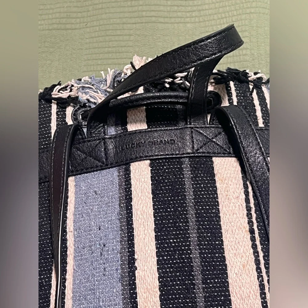 Lucky Brand Alzon Drawstring Clinched Fringed Backpack Blue, Black and Cream